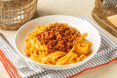 Bowl of egg pasta with meat ragu sauce
