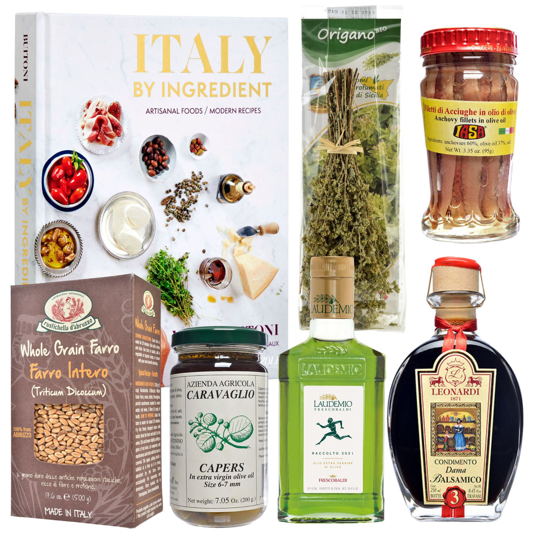 Italy by Ingredient cookbook with Frescobaldi Laudemio Extra Virgin Olive Oil, Leonardi Dama Balsamic Vinegar, Rustichella d'Abruzzo Farro, Caravaglio Capers, Gangi Dante Oregano Branches and IASA Anchovies against a white background