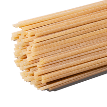 Strands of Tirrena Linguine pasta against a white background
