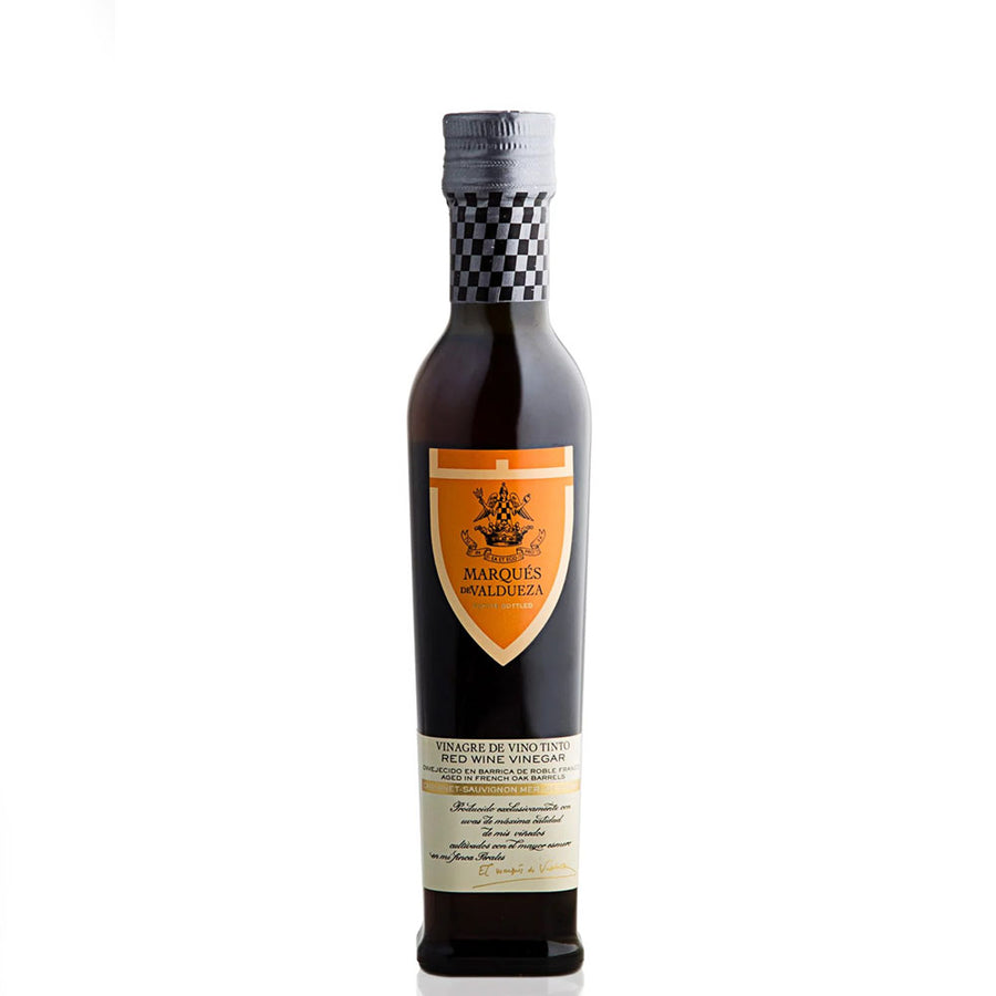 Bottle of Marques de Valdueza red wine vinegar on a white background