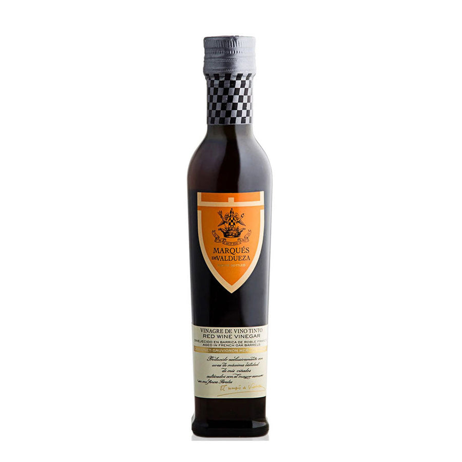 Bottle of Marques de Valdueza red wine vinegar on a white background