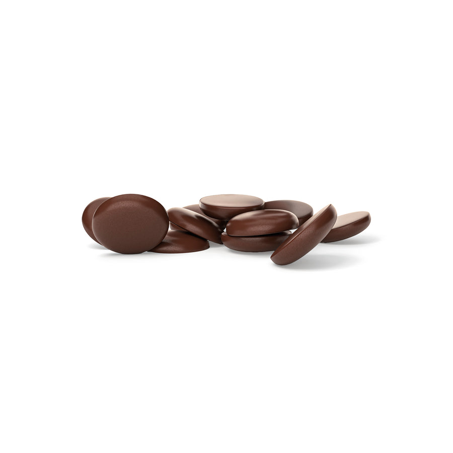 Dark chocolate drops on a white background
