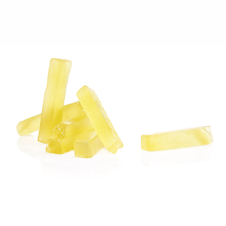 Candied ginger strips on a white background