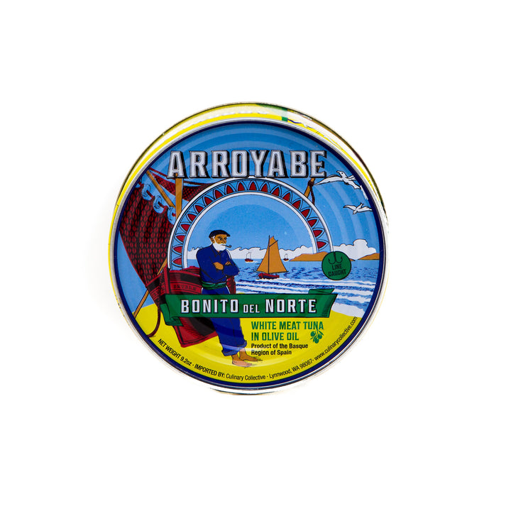 Round tin with 'Arroyabe' branding on a white background