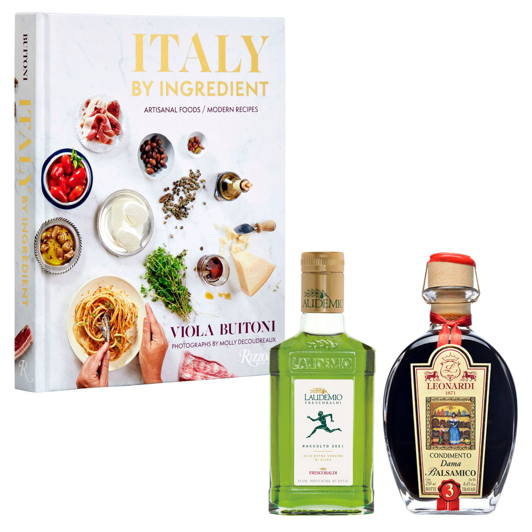Italy by Ingredient cookbook with Frescobaldi Laudemio Extra Virgin Olive Oil and Leonardi Dama Balsamic Vinegar against a white background