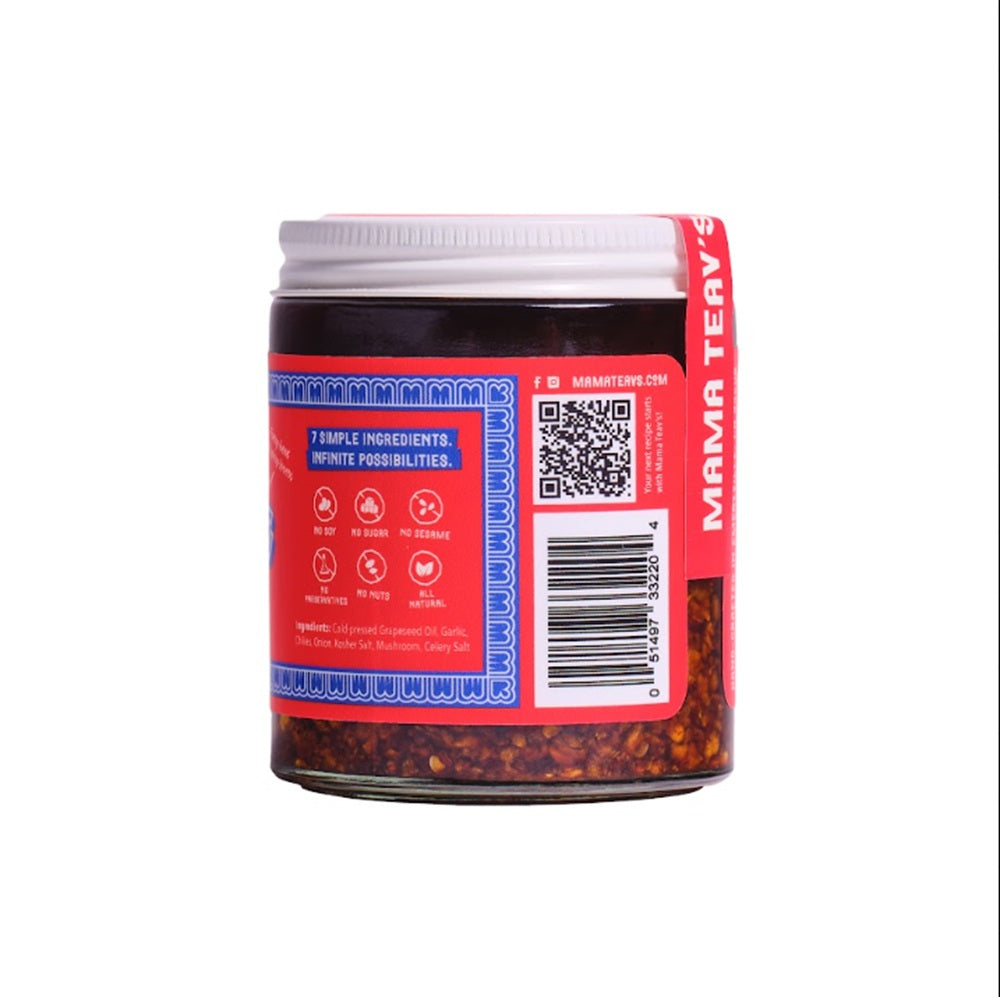 A jar of Mama Teavs shown from the back, displaying a red and blue label with a QR code and barcode, on a solid white background.