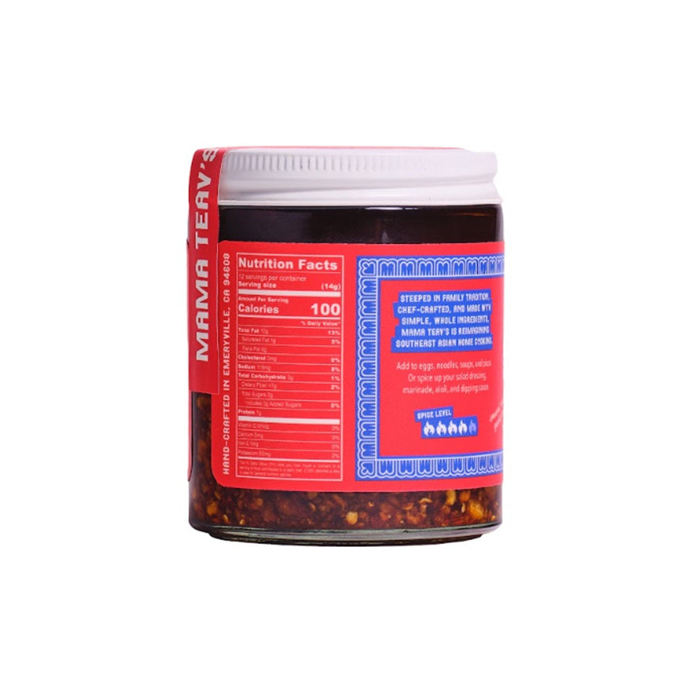 A glass jar of Mama Teavs, showing the red and blue nutrition facts label on the side, set against a plain white background.