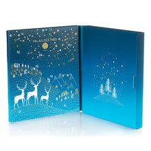 Open palais des thes blue advent calendar revealing white reindeer, christmas trees and gold stars