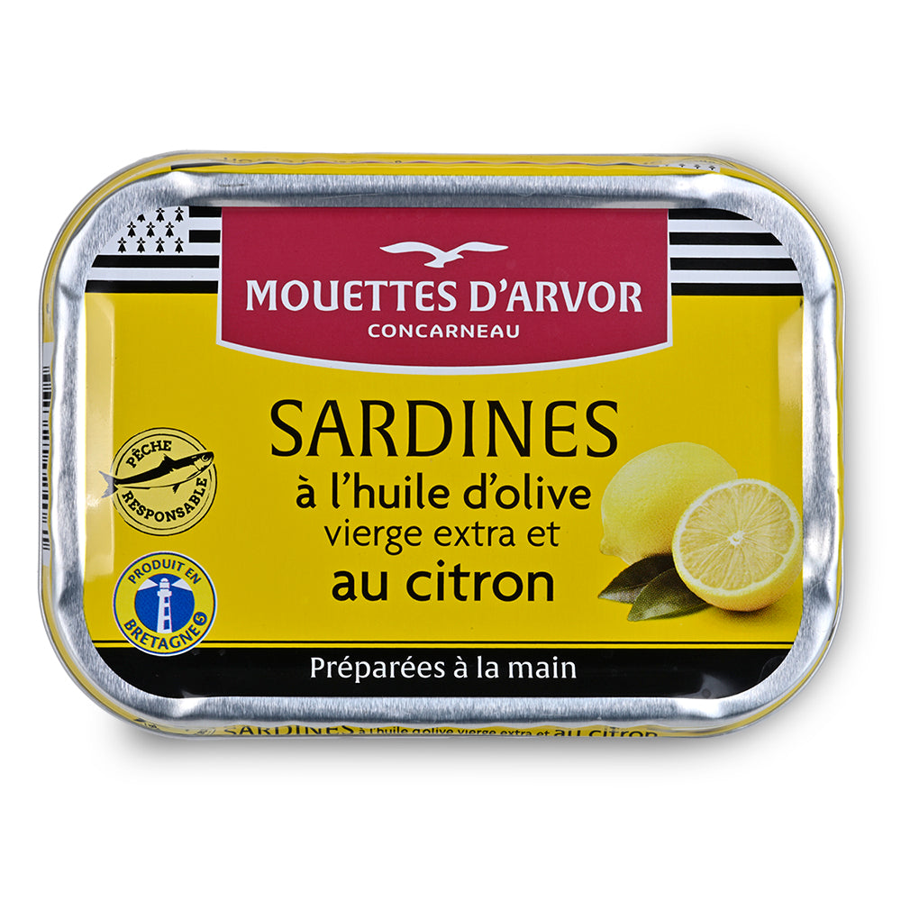 Mouettes tinned sardines with lemon on a white background