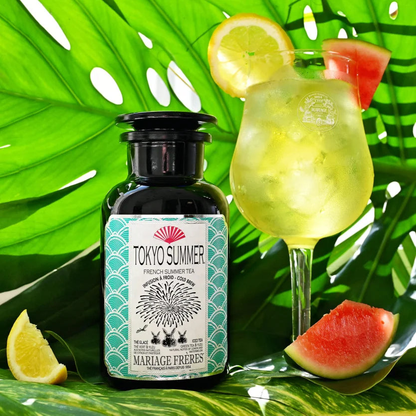Tokyo Summer iced tea in a glass garnished with yuzu and watermelon