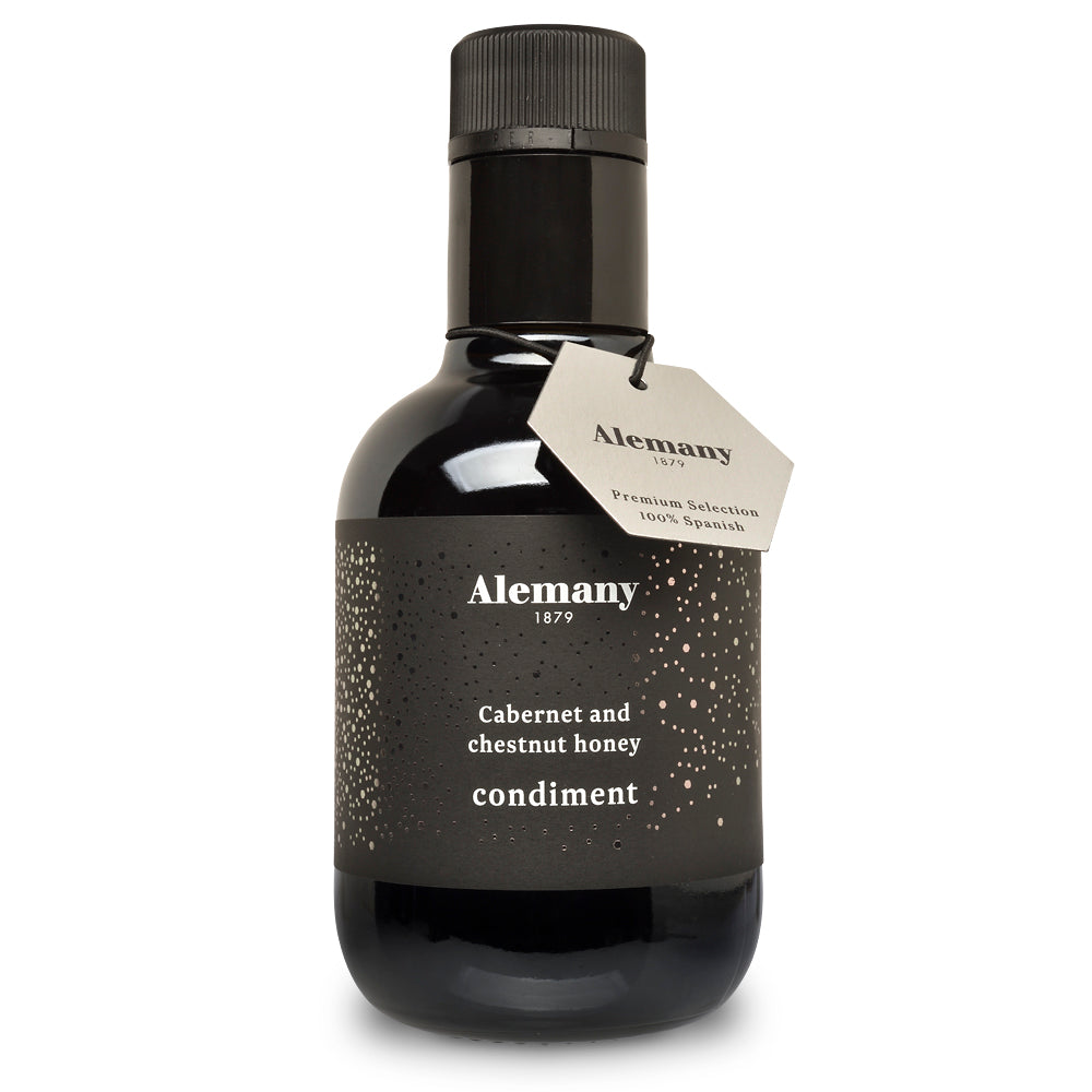 Black bottle of Alemany 1879 condiment with a visible label on a white background