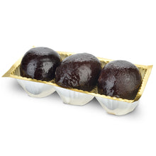 Close up of three Agen prunes stuffed with Armagnac mousse