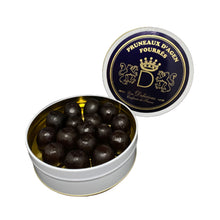 Open round tin of Agen Prunes stuffed with mousse