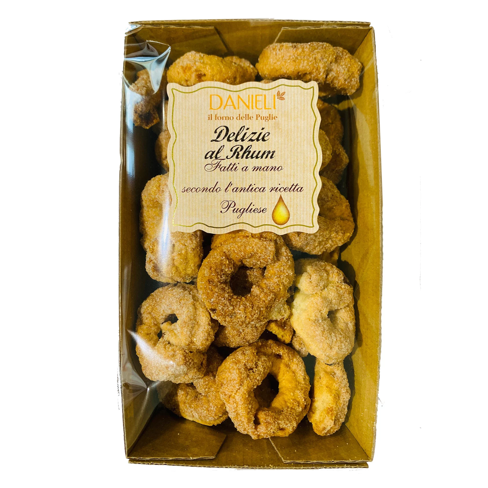 Box of 'Delizie al Rhum' snacks with a Daniel label on a white background