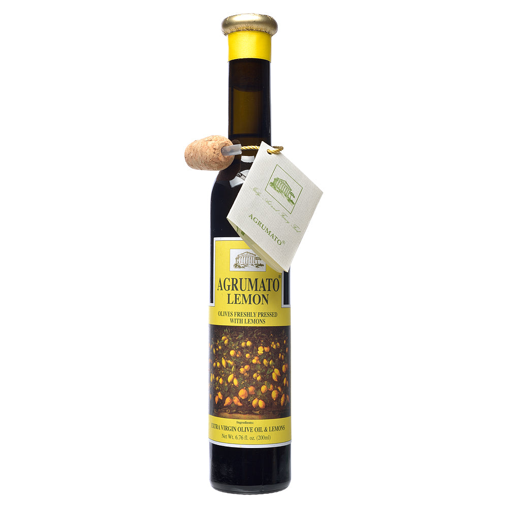 Bottle of Agrumato Lemon olive oil with a cork on a white background