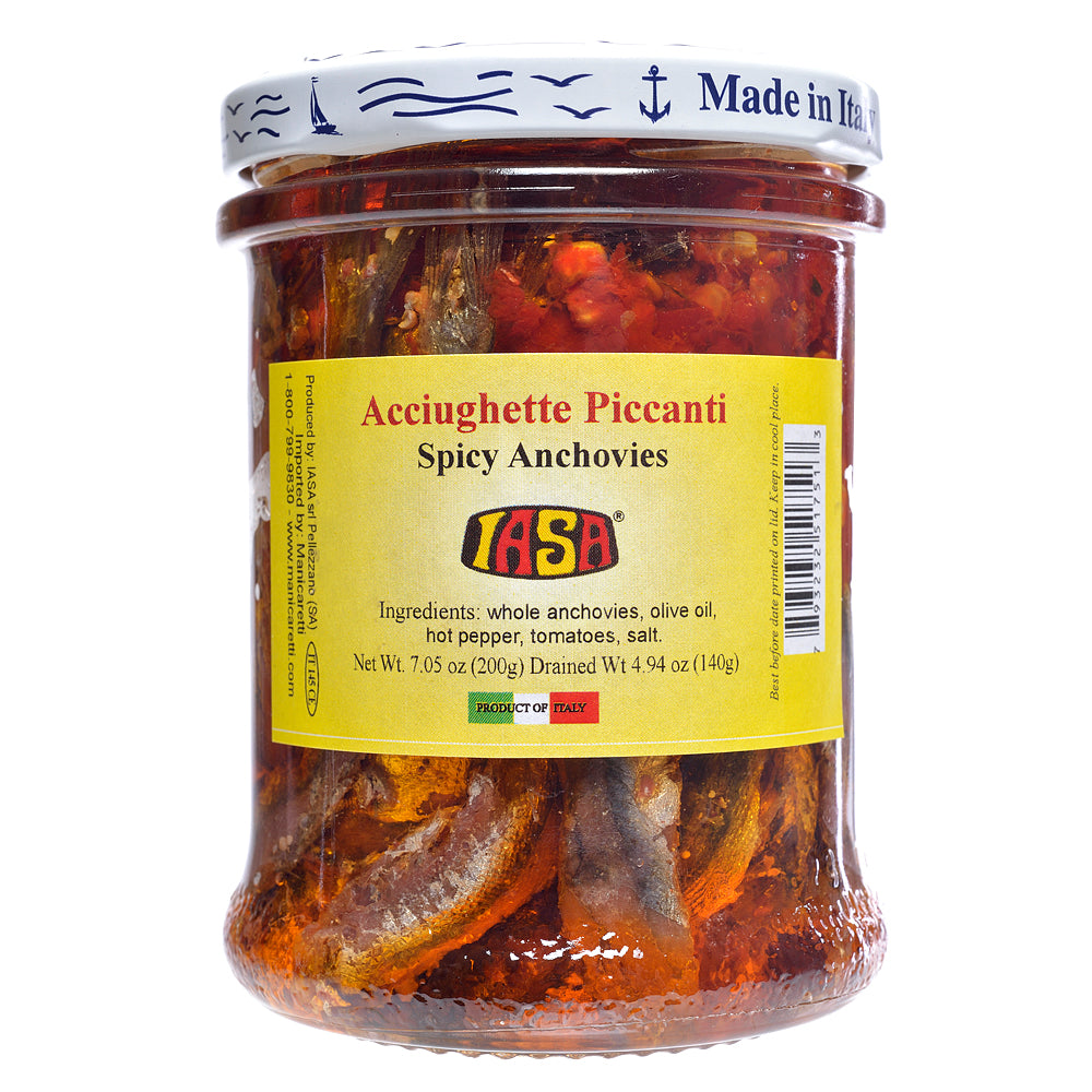 Jar of spicy anchovies with a yellow label on a white background