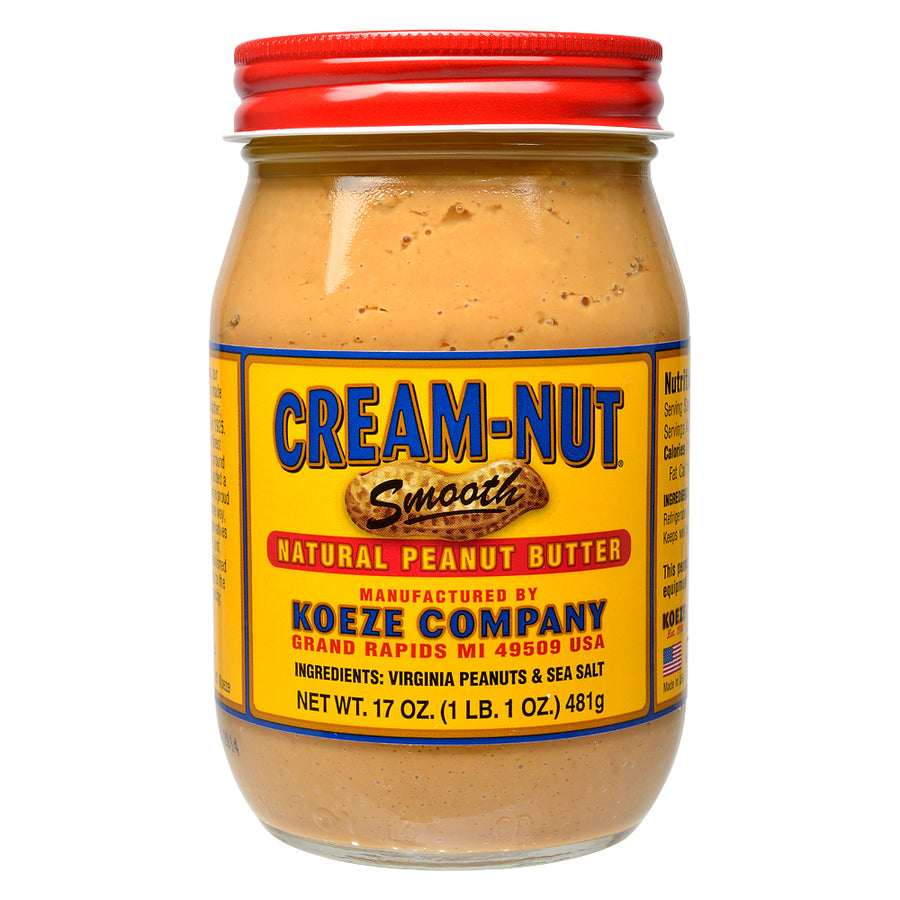 Jar of Cream-Nut Smooth Natural Peanut Butter with red lid on a white background