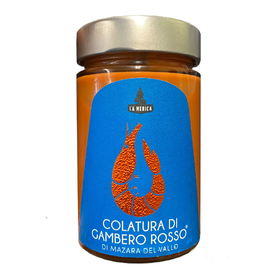 Jar of Colatura di Gambero Rosso with blue label and gold lid on white background