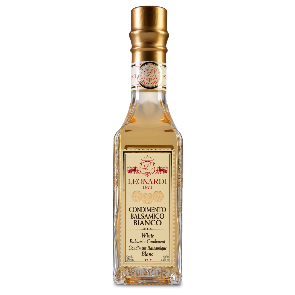 A bottle of Acetaia Leonardi White Balsamic Condiment with a golden-hued liquid visible through the transparent glass.