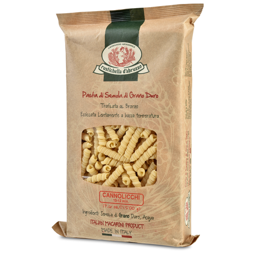 Packaged pasta product 'Cannolicchi' from Rustichella d'Abruzzo visible through a window on a brown paper bag packaging.