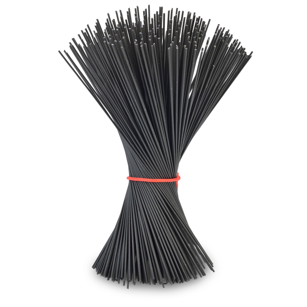Bunch of black squid ink pasta tied with a red rubber band on a white background
