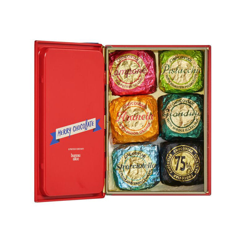 Box of assorted chocolates with colorful packaging on a white background