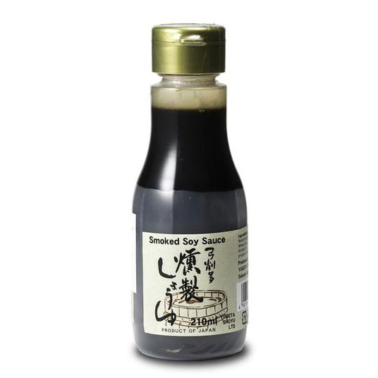 Bottle of smoked soy sauce with a gold cap on a white background
