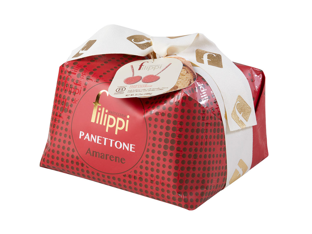Amarena Panettone from Pasticceria Filippi wrapped in red paper with a white bow.