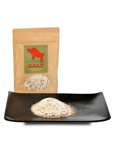 Plate with pile of Omnivore Salt with the bag behind it